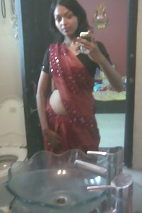 Indian babe taking shower posing