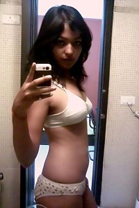 Indian babe taking shower posing