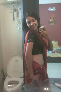 Indian babe taking shower posing