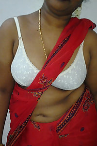 Mature indian housewife taking her indian outfits off in bedroom