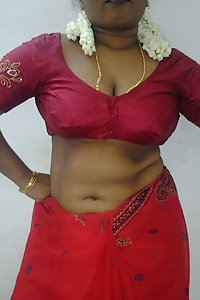 Mature indian housewife taking her indian outfits off in bedroom